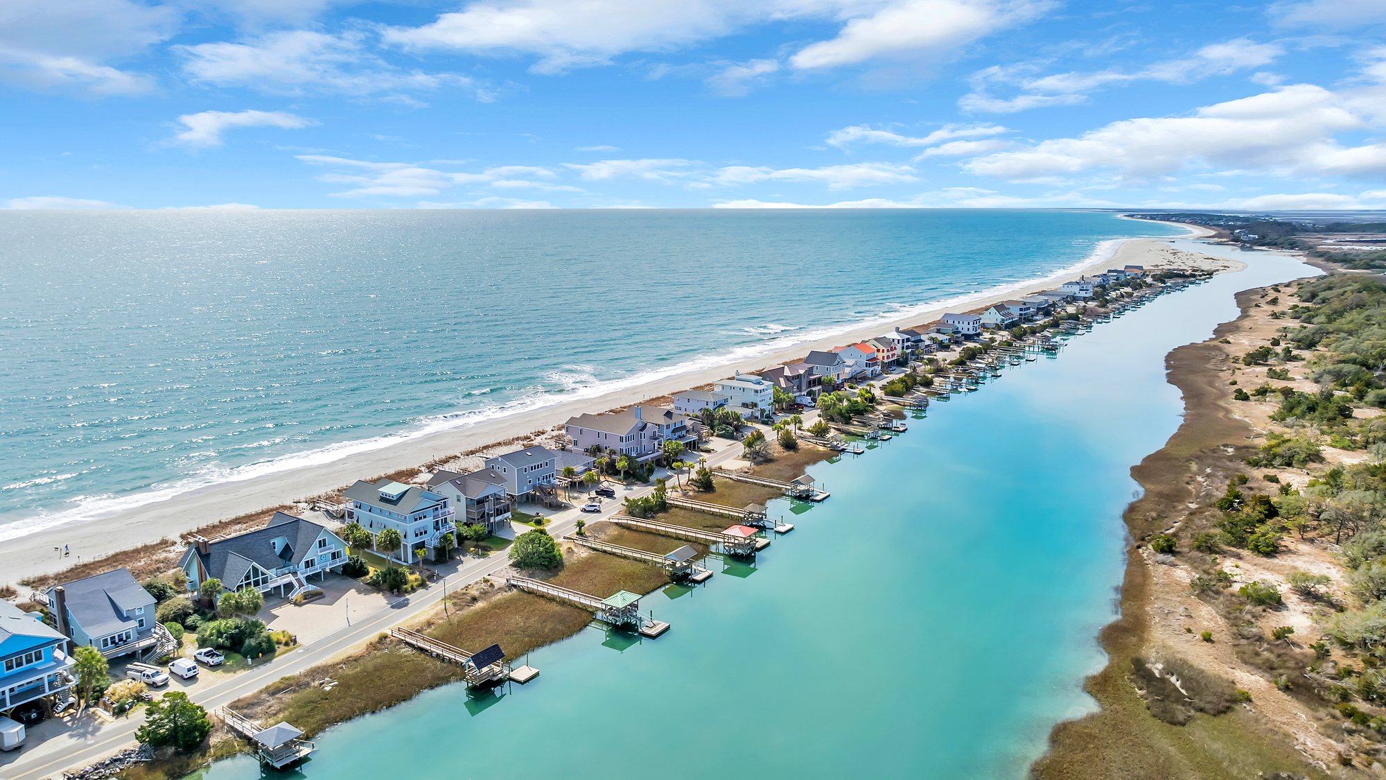 Beach homes along the oceanfront with the creek behind them on the Grand Strand
