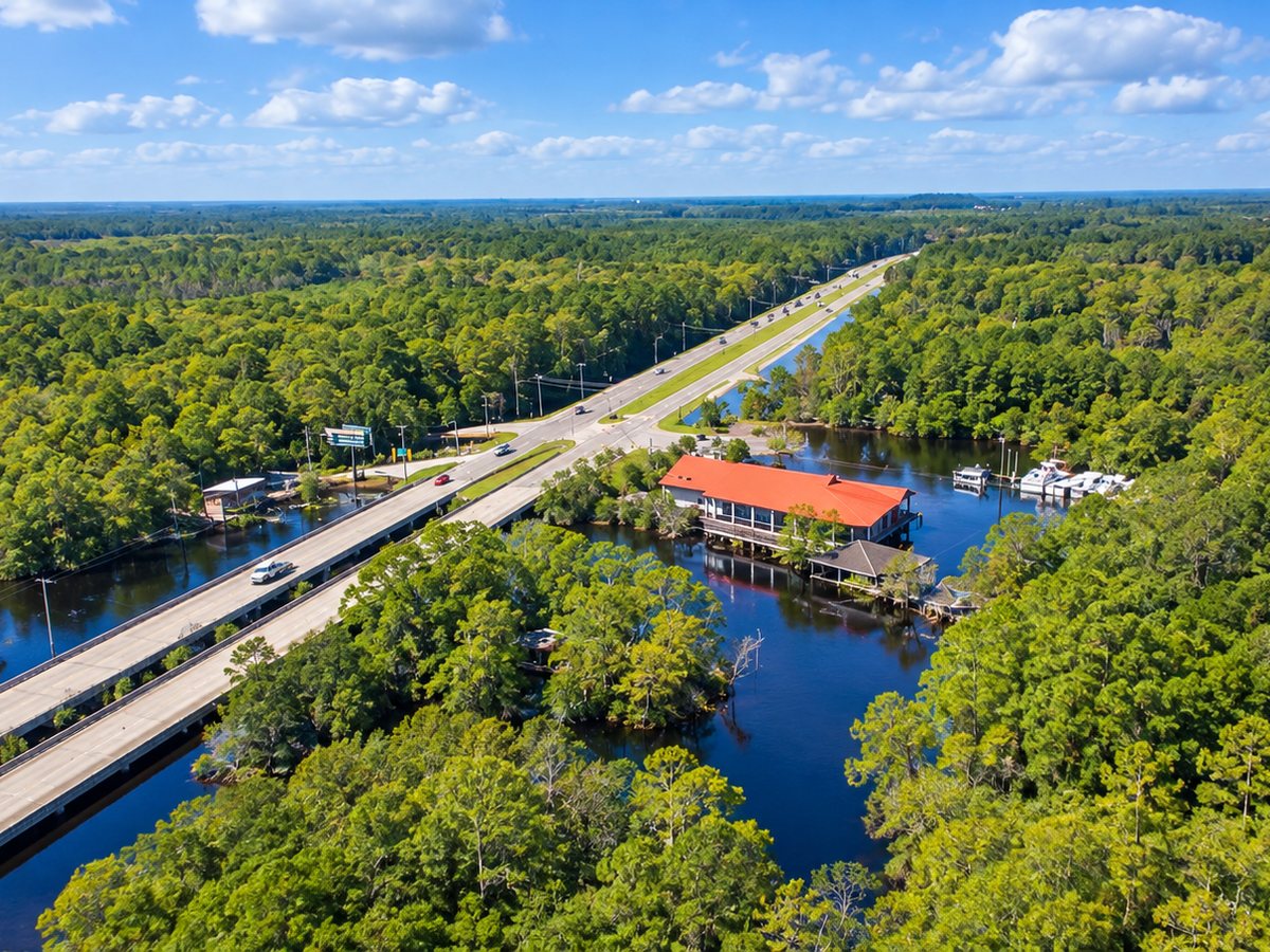 The highway bridge over the river and cypress woods near Longs